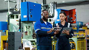 Two people in manufacturing environment