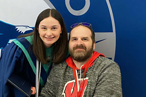 Jack Brunslik poses for a photo with his daughter, Sara, at her high school graduation ceremony in May 2024