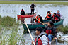 kids in canoes ricing