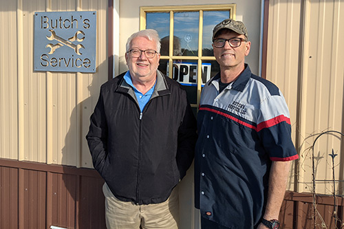 Butch and his former DVR counselor Paul Untiet in front of Butch's Service LLC. 
