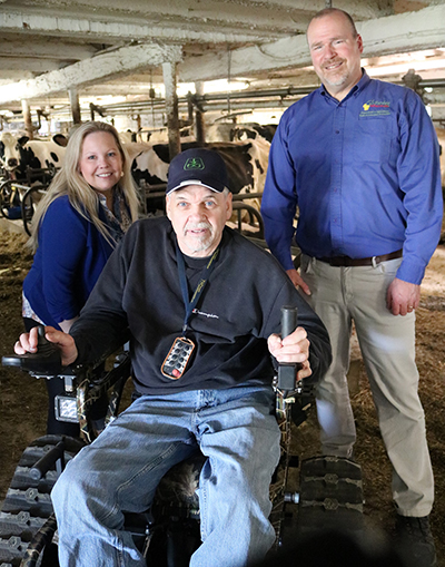 DWD Secretary-designee Amy Pechacek, left, and DATCP Secretary Randy Romanski, right, meet with farmer Darrel Jones to learn more about his use of assistive technology. Darrel and his wife Kathy own and operate an approximately 60 cow dairy farm in Auburndale, Wisconsin.