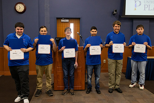 Graduates from the 2022 UW-Platteville Project SEARCH class pose for a photo with their certificates. Left to right: Tom Abell, Payton Gibson, Sam Gilmore, Diego Ruiz, Paxton Tuescher, Anthony Varela