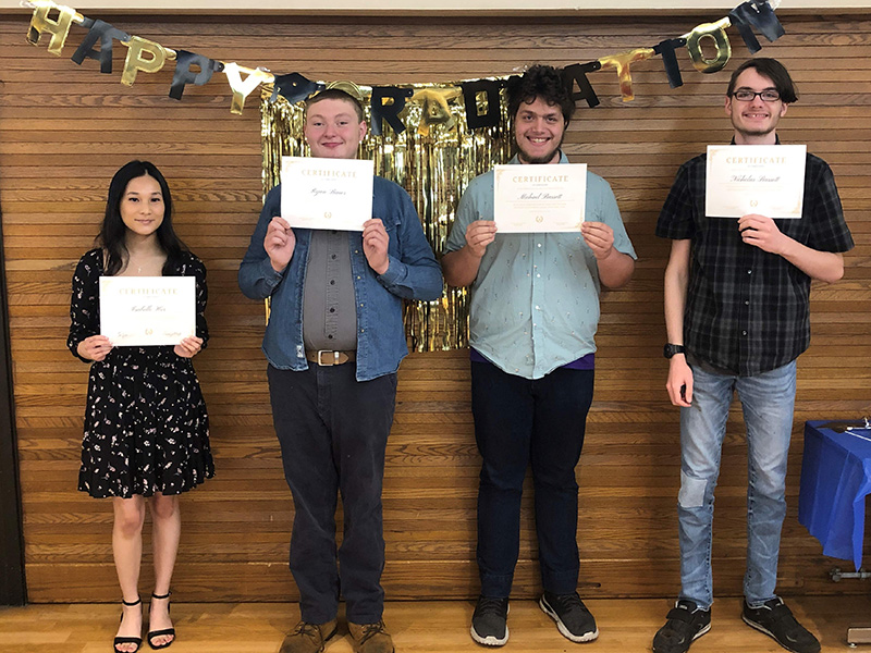 Isabelle Her, left, was one of four Project SEARCH interns who graduated from an immersive training program at the University of Wisconsin-Stout on Friday, May 12. Also pictured, left to right, are fellow Project SEARCH graduates Ryan Bauer, Michael Bassett and Nicholas Bassett.