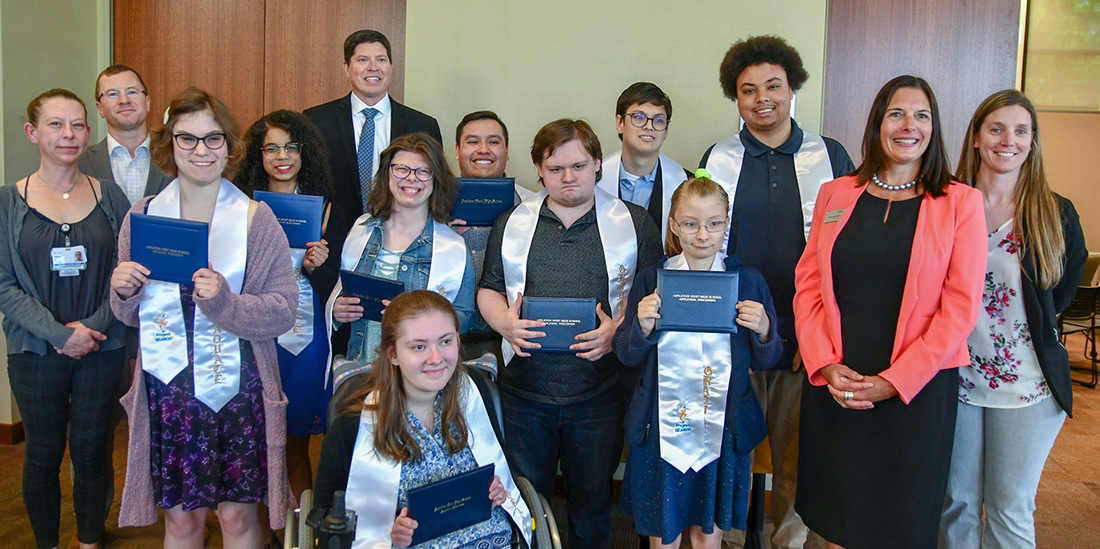 Officials from Appleton Area School District, Ascension St. Elizabeth Hospital, and the Wisconsin Department of Workforce Development joined for a graduation ceremony for nine young adults in the Project SEARCH program. 