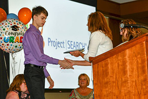 Bennett Bares accepts congratulations after completing Project SEARCH. A graduation ceremony was held June 7, 2023, at West Bend Mutual Insurance with family, friends, and educational and workforce mentors.