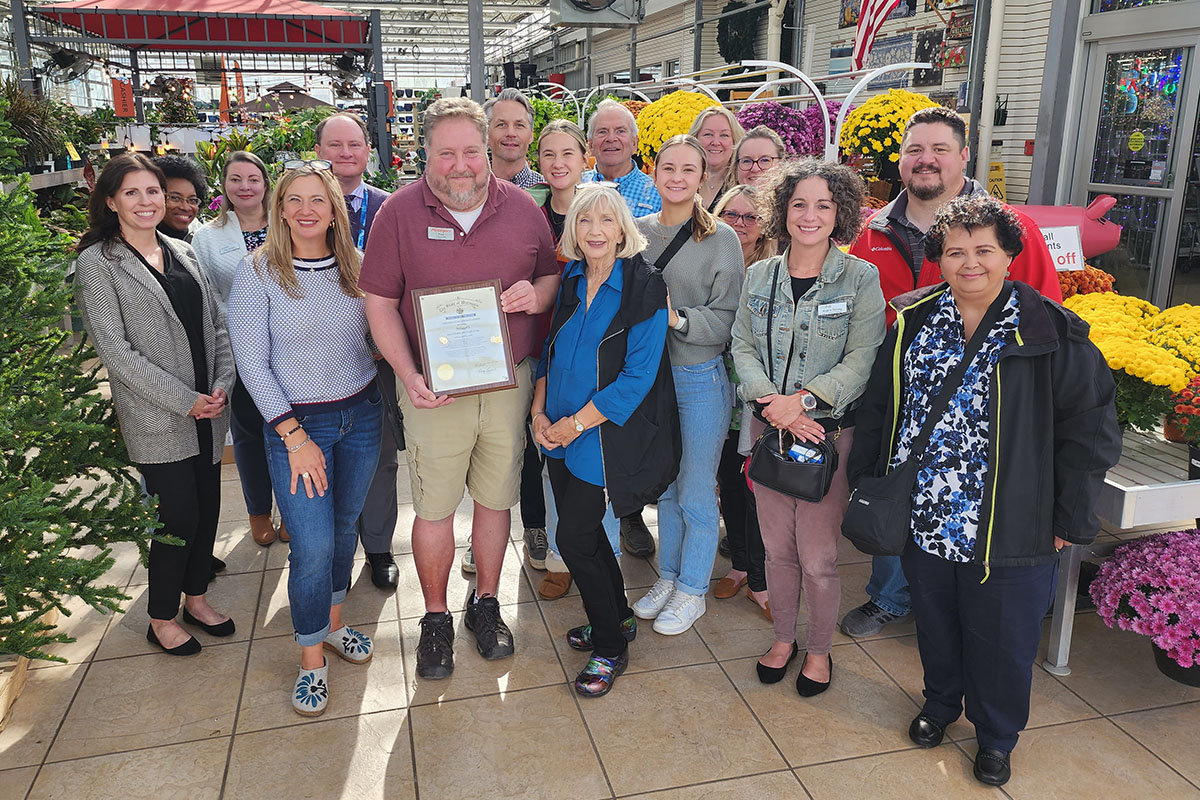 Milaeger's General Manager Paul Sikorski is surrounded by his Milaeger's team members and their family, along with local DVR representatives and local service providers. 