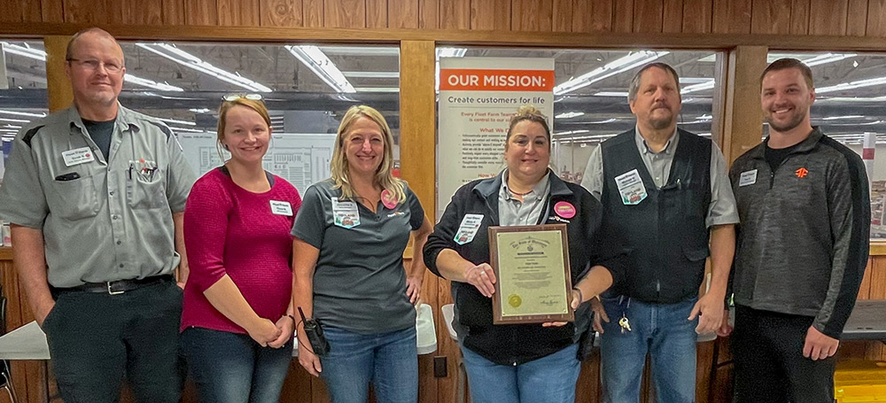 Store Manager Becky Sheridan accepts Fleet Farm's Exemplary Employer Award while surrounded by her store's leadership team. Left to right: Automotive Services Manager Scott Schiltz, Fleet Farm Antigo Human Resources Representative Tiana Barron, Assistant Store Manager Deyonna Shannon, Store Manager Rebecca Sheridan, Assistant Store Manager Mike Hodgins, and Senior Manager Tom Schumacher.