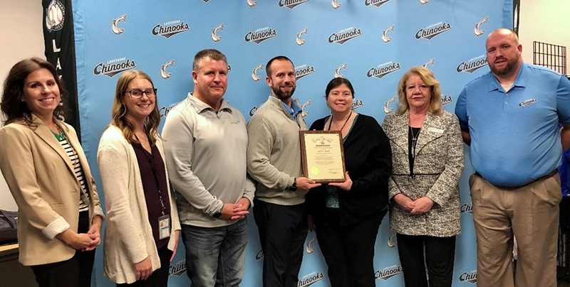 The Lakeshore Chinooks were recognized as an Exemplary Employer during an event at their Menomonee Falls headquarters on Thursday, Nov. 16. The award is presented to employers for their diverse and inclusive hiring practices. Pictured from left to right: Allison Gordon, DVR Consumer Services Director, Elizabeth Para, DVR Counselor; Phil Konrath, Transitions Development Job Developer/Coach and Mentor; Robert Rothe, Lakeshore Chinooks Assistant General Manager; Amy May, DVR Director; Denise Puffer, DVR Business Services Consultant; and Eric Snodgrass, Lakeshore Chinooks General Manager. 