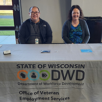 DVOP Mike Xiong and LVER Sara Lazarz conducting outreach at the 15th Annual Veterans Day Event in Eau Claire WI. Sponsored by Minnesota Wire