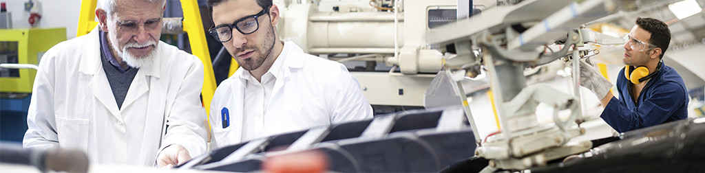 Workers in factory setting.